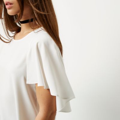 White cape sleeve top